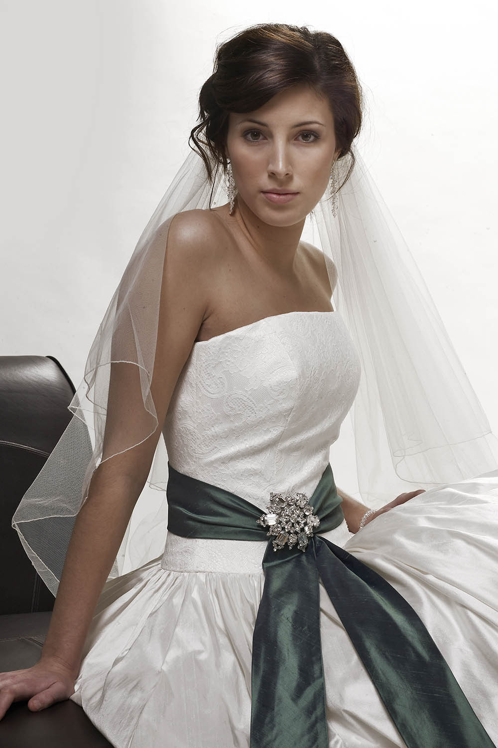 Bridal veil shown with wedding dress